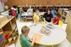 Senior Cammy Hester works with students in the art center. High school students rack up 175 hours working at the preschool for three periods during the school day.