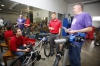 Holmes Middle School (Covington Independent) teacher Jeff Haney, center, checks in on groups during the STEM Bike Club at the school.  Photo by Amy Wallot, April 13, 2015