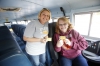 Bus drivers Jonna Moore and Laurie Cowan pass out tickets to students who show good behavior while riding the bus in Hopkins County.Photo by Amy Wallot, Oct. 16, 2014