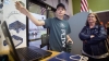 Brody Fugate, a freshman at iLEAD Academy from Trimble County, shows off his reverse engineering project at to Renee Cameron during the demonstration at the iLEAD Academy in Carrollton. Photo by Bobby Ellis, March 24, 2016