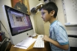 Second-grade student Ishaan Choch writes a blog post about his recent trip to India during Cheri Arrowood\'s class at Jackson City School (Jackson Ind.). The writing Program Review includes communications for the 21st century. Photo by Amy Wallot, April 2011
