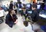 Fifth-grade students Jacob Traughber, Gustavo Ramirez and Javarius Rogan share with Superintendent James Flynn their plans on controlling their robot during Stephen Guthrie's robotics class at Lincoln Elementary School (Simpson County).Photo by Amy Wallot, Dec. 4, 2014​