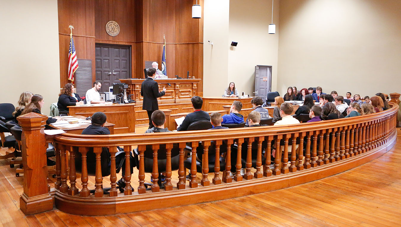 Students from a career pathways class at East Jessamine Middle School (Jessamine County) look on as they serve as a jury for a mock trail practice conducted by students from the pre-law pathway at Jessamine Career and Technology Center.Photo by Mike Marsee, Dec. 9, 2019