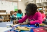 Nevaeh Riley, a 2nd-grade student at Johnson Elementary School (Laurel County), colors a bookmark during a class in which students were working on entries for an art contest. Visual and performing arts education is a daily part of the school's curriculum. Photo by Bobby Ellis, Nov. 18, 2016