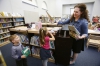 Library media specialist Heidi Neltner shows kindergarten student Elias Spaw a few books he might want to check out at Johnson Elementary School (Ft. Thomas Independent).Photo by Amy Wallot, Sept. 17, 2014