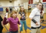 Minie Stump and Kyle Latta box each other using Wii boxing during Amanda Yarbrough\'s gym class at Bullitt Lick Middle School (Bulitt County). Behind them sixth-grade student Katie Sims follows along with the movements.Photo by Amy Wallot, Dec. 1,  2009