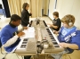Teacher Allison Butner works with sophomores Buster McKinney, Nicky Snyder and Franko Beard during keyboarding class at Fulton Independent School. Photo by Amy Wallot, Jan. 20, 2010
