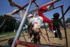First-grade student Maria Velazquez plays on the monkey bars during recess at Gallatin Elementary School (Gallatin) Aug. 13, 2007.Photo by Amy Wallot