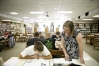 Misty Cox helps sophomore Jared Hendricks with a report about the 1950's  at Johnson Central High School (Johnson) May 28,  2010.
Photo by Amy Wallot