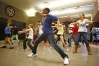 Twenhofel Middle School (Kenton County) 8th-grade student Jon Webster leads a group of students as they practice a dance to Shakira's "Waka Waka" for a performance at Dixie Heights High School as part of the ASCENT Arts program  Jan. 18, 2011.Photo by Amy Wallot