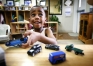 Ke'von Lee Wilson Theus puts toy trucks away before lunch during preschool at Morganfield Elementary (Union) April 22, 2008.
Photo by Amy Wallot