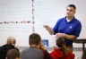 Jason Bryant teaches his social studies class at King Middle School (Mercer County). Bryant\'s students are raising funds for the Kentucky National Guard Memorial and he is tying economic and civic lessons in to project. Photo by Amy Wallot, April 11, 2014
