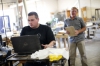 Burgin Independent senior Jay Millerworks under the instruction of Kentucky School for the Deaf advanced manufacturing instructor Jay Cloud. Photo by Amy Wallot, Aug. 24 , 2015
