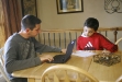 LaRue County High School sophomore Jackson Venegas and his younger brother Ezekiel work on homework. The school’s 1:1 laptop initiative allows students to take home their laptops. Photo by Amy Wallot; March 2011