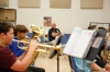 Charles Parker, a member of a member of the Laurel County schools’ Security Response Team, listens as trumpet player Braxton Campbell, euphonium player Johnathan Fultz and other students tune their instruments in the music room at South Laurel Middle School. Parker said he has been moved by the way students and staff members have treated him since he began working at the school.Photo by Mike Marsee, Sept. 27, 2018