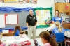Dan Parks, a member of the Laurel County schools’ Security Response Team, visits with students in a 4th-grade class taught by his daughter, Heather Comeens, right, at Bush Elementary School (Laurel County). Parks is assigned to a school where two daughters work and three grandchildren are students. Many members of the team are assigned to schools where members of their family work or study.Photo by Mike Marsee, Sept. 27, 2018