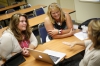 Ashland Independent music teacher Leigh Holderness and Rodburn Elementary School (Rowan County) principal Andrea Murray discuss strategies for program reviews with Sarah Evans. Photo by Amy Wallot, July 13, 2015