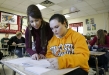 Brittany Hensley, left, helps sophomore Paige Shepherd with an Algebra II problem at Leslie County High School Jan. 5, 2011. Photo by Amy Wallot