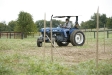 Henry Clay High School (Fayette County) senior Daniel Silver drives a tractor through a wood-staked course at Locust Trace AgriScience Farm (Fayette County). Silver said he had driven a riding lawn mower before, but never a tractor. Photo by Amy Wallot, Sept. 28, 2011