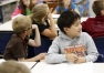 Brandon Wu, a 2nd-grade student at Mann Elementary School (Boone County), listens to teacher Lisa Willoughby discuss The Castle in the Attic by Elizabeth Winthrop. Willoughby said her students always look forward to reading the book. Photo by Amy Wallot, May 1, 2014