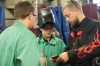 Jordan Tedrow, left, a welding instructor at Marion County Area Technology Center, shows two 8th-grade students what a good weld should look like. Tedrow said working with younger students was an adjustment for him, but the class has gone well. Photo by Megan Gross, Oct. 15, 2018