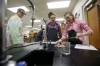 Joshua Underwood watches junior Hannah Jackson and Brittany Alley mix sodium with phenolphthalein to watch for a chemical reaction during  his chemistry class at Mason County High School.  Photo by Amy Wallot, Jan. 9, 2015​