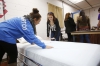 Seniors Marley McCollum and Miranda Wheeler turn a closed bed into an open bed during Medicaide Nurse Aide 100, a dual-credit class at Mayfield/Graves County ATC offered through West Kentucky Community and Technical College. Photo by Amy Wallot, Dec. 10, 2014