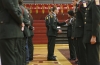 Sophomore Cameron Kinman inspects JROTC cadets\' uniforms at McLean County High School. Photo by Amy Wallot, March 12, 2013