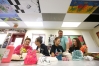 Art instructor Chris Long talks with Cheyanna Trumbo, Hayley Bragg, Haley Hunt and Brittany Scott at Metcalfe County High School. Long encourages his students to enter their work in as many contests as they can for recognition and scholarship money. Photo by Amy Wallot, May 17, 2013