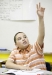Fifth-grade student J\'Oavean Kelly raises his hand to answer a question about the book