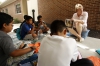 Vivian Bowles, a 4th-grade teacher at Kit Carson Elementary School (Madison County), reads Where the River Begins to students before having them write their own stories. Photo by Amy Wallot, June 23, 2015