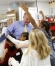 Third-grade students rush to hug their teacher Ryan Williams after an assembly were he was given the Milken Family Foundation National Educator Award at Mary Lee Cravens Elementary School (Owensboro Independent). Photo by Amy Wallot, Dec. 11, 2012