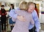 Third-grade teacher Ryan Williams hugs long-time friend and co-worker Karen Allinder after he receives the Milken Family Foundation National Educator Award at Mary Lee Cravens Elementary School (Owensboro Independent). Photo by Amy Wallot, Dec. 11, 2012