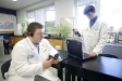 Senior Garris Stroud, right, uses a heart rate monitor to test the biological effects of music on senior Vaughn Reed as part of his project for the STEM. Academy at Muhlenberg County High School. Photo by Amy Wallot, Jan. 6, 2012