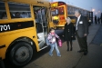Second-grade teacher Layton Batts and Education Commissioner Terry Holliday greet students getting off the bus at Murray Elementary School (Murray Independent). Photo by Amy Wallot, Jan. 11, 2012