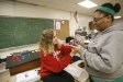 Senior Mary Vorhees and Bria Staten-Favors work together launching and taking measurements from a spring launched item during Michael Barker\'s Honors Physics class at Newport High School (Newport Ind.). Photo by Amy Wallot, Feb. 9, 2012