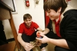 Seniors Jarrod Elliott and Jake Specht take angle measurements while trying to launch a sling shot device during Michael Barker\'s Honors Physics class at Newport High School (Newport Ind.). Photo by Amy Wallot, Feb. 9, 2012