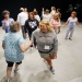 Kenton County gifted instructor Penny Thomas and Georgetown Middle School (Scott County) teacher Brittany Leach learn the Sir Roger de Coverley dance during the Next Generation Academy in Lexington. Photo by Amy Wallot, June 16, 2011