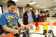 Seventh-grade students Darren Cornwell and Wally Schmidt look over the advanced robots the after-school robotics team built at North Marshall Middle School (Marshall County) Feb. 23, 2011. Both students are members of the team.Photo by Amy Wallot