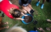 Teachers plant vegetable seeds during an outdoor learing workshop at Kit Carson Elementary (Madison County). Photo by Bobby Ellis, June 15, 2017