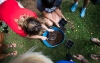 Teachers plant vegetable seeds during an outdoor learing workshop at Kit Carson Elementary (Madison County). Photo by Bobby Ellis, June 15, 2017
