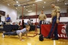 Pfc. Paul Banks and Staff Sgt. Barry Forrest time 8th-grade student Noah New\'s push-ups during an Operation Preparation college and career fair at Owen County High School. Photo by Amy Wallot, March 11, 2014