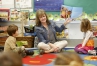 Preschool teacher Felechia Wainscott reads an alphabet book about construction to her class and then themed all of her centers that day around construction and city building. Photo by Amy Wallot, March 12, 2015