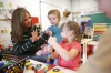 Teaching assistant Gale Mullins helps preschool student Angela O'Neal with counting ad sorting in Owen County. Photo by Amy Wallot, March 12, 2015
