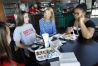 Owensboro Innovation Academy head teacher Beth Benjamin talks with students during lunch. Photo by Amy Wallot, Aug. 24 , 2015