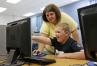 Shannon Hill helps Elijah Stringer during her 4th-grade technology class at Owingsville Elementary School (Bath County). Photo by Amy Wallot, May 17, 2013