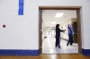 P.E. teacher Rhonda Smith watches Meagan Sipple do jumping jacks as part of the fitness scavenger hunt in her lifetime fitness and leisure studies class at Lloyd High School (Erlanger-Elsmere Independent). Photo by Amy Wallot, Feb. 24, 2015