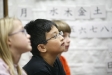 Fourth-grade students Sarah Howell, Alexander Dimayuga and Alden Beers learn words for different sports and activities during Miko Momozono\'s Japanese class at Picadome Elementary School (Fayette County). Photo by Amy Wallot, Jan. 10, 2012