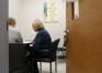 Lori Price, coordinator of student/family support services for Pulaski County Schools, talks with a freshman student about his concerns with new classes he is enrolling in. Price uses the Check & Connect intervention system to foster engagement with students. Photo by Amy Wallot, Feb. 12, 2015