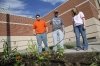 Sophomore Cody Willhoite, junior Michael Miller and sophomore Meranda Sizemore water plants at the school garden at Bryan Station High School (Fayette County) May 26, 2010. Photo by Amy Wallot